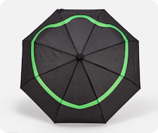 Open umbrella seen from above, showing the green duck print